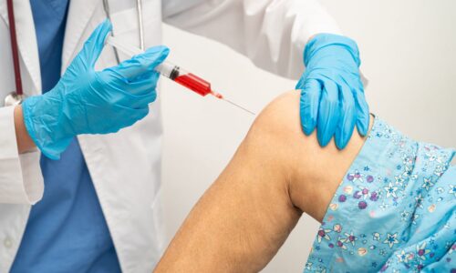 Elderly woman getting Injection Rehab Service